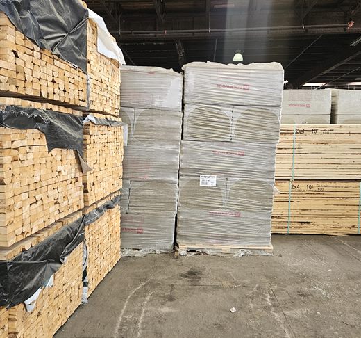 Stacked lumber and building materials in the Home Lumber yard