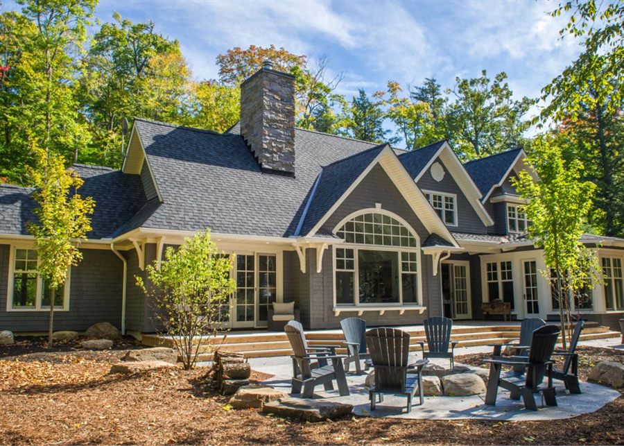 A home finished with gray wood siding