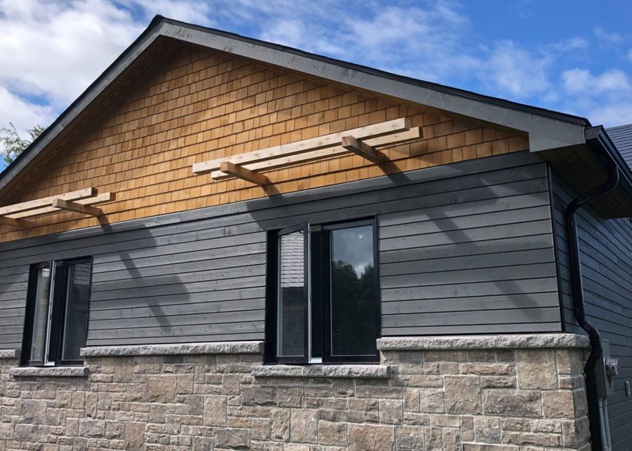 Cedar shingle and horizontal wood siding on a home exterior